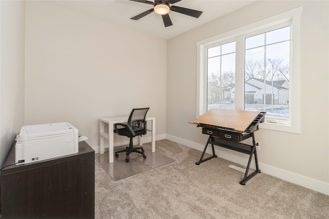 carpeted office featuring ceiling fan and plenty of natural light