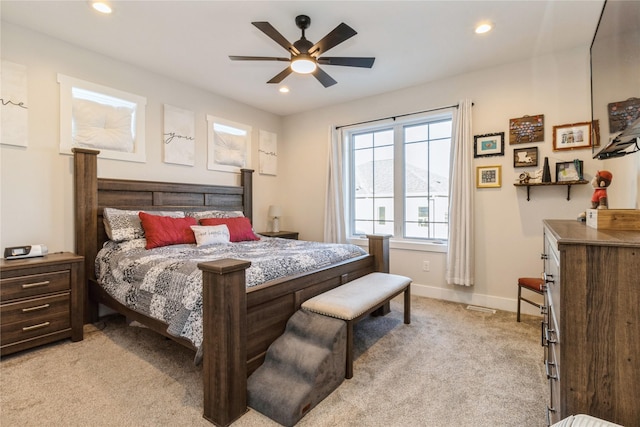 bedroom featuring ceiling fan and light colored carpet