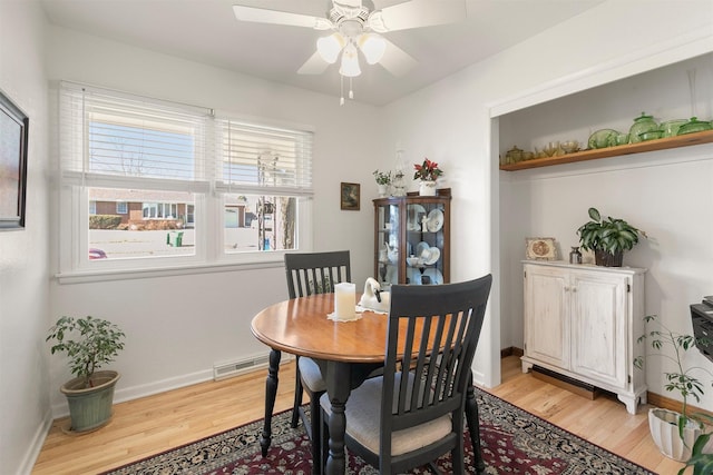 dining room featuring ceiling fan and light wood-type flooring