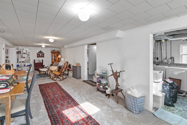 basement with washer and dryer and carpet floors