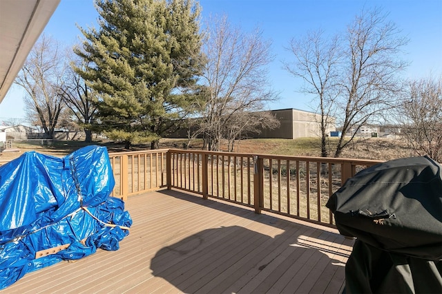 wooden terrace featuring area for grilling