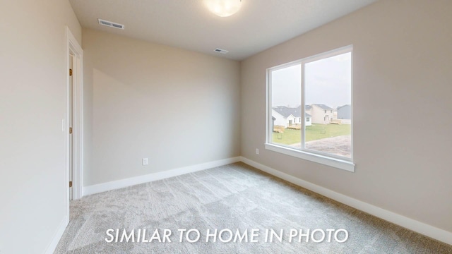 503 43rd St SW, Altoona, IA 50009 - carpeted spare room featuring visible vents and baseboards