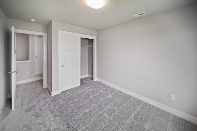 503 43rd St SW, Altoona, IA 50009 - unfurnished bedroom with a closet, carpet floors, and baseboards