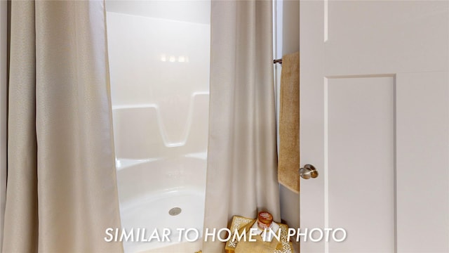 bathroom with curtained shower