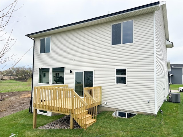 7046 SE 7th Ave, Pleasant Hill, IA 50327 - back of property with a deck, a yard, and central AC