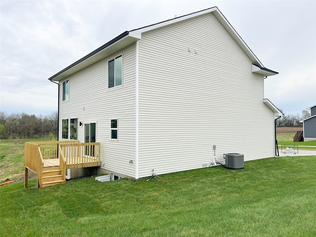 7046 SE 7th Ave, Pleasant Hill, IA 50327 - view of side of property featuring a deck, cooling unit, and a yard