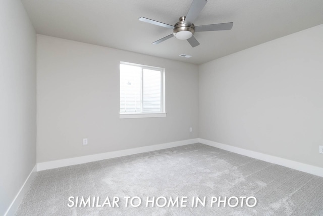 empty room with ceiling fan, baseboards, and carpet flooring