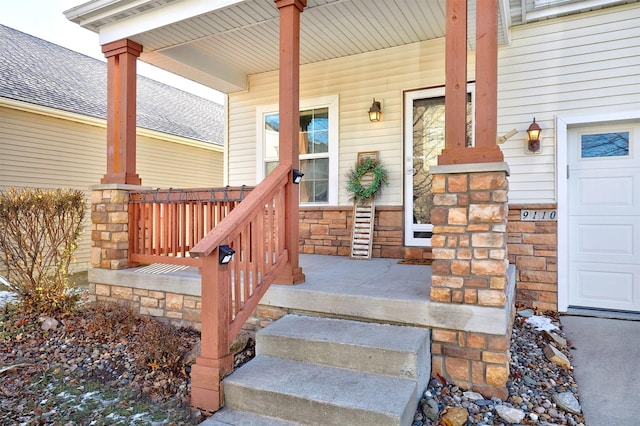 view of exterior entry with a porch