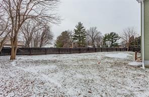 view of yard layered in snow