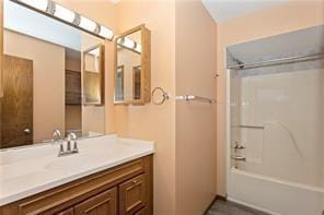 bathroom with shower / bathtub combination and vanity