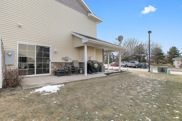 exterior space with central AC and a patio