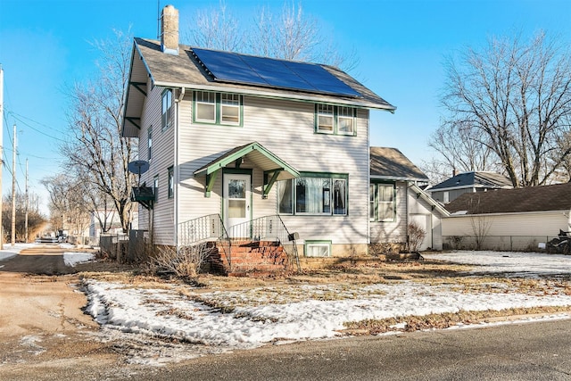 view of front of home featuring solar panels