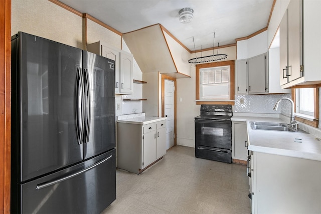 kitchen with white cabinets, black / electric stove, fridge, and sink