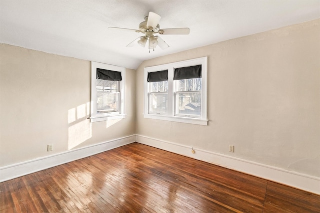 unfurnished room with ceiling fan, vaulted ceiling, and hardwood / wood-style flooring