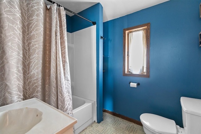 full bathroom featuring toilet, shower / bath combination with curtain, and sink