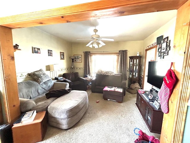 living room with ceiling fan and carpet floors