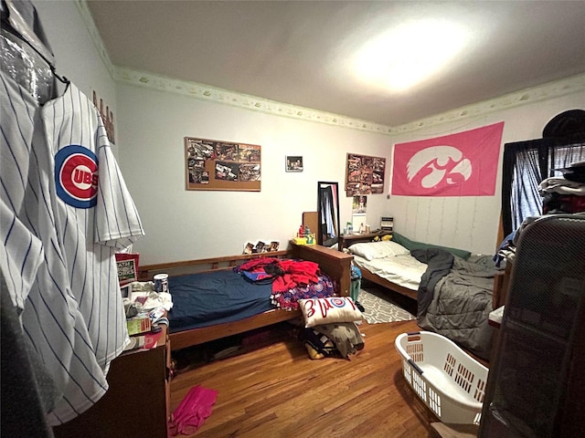 bedroom with hardwood / wood-style floors