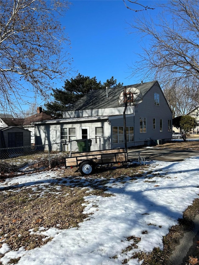 view of snow covered house