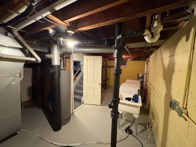 basement with heating unit and water heater