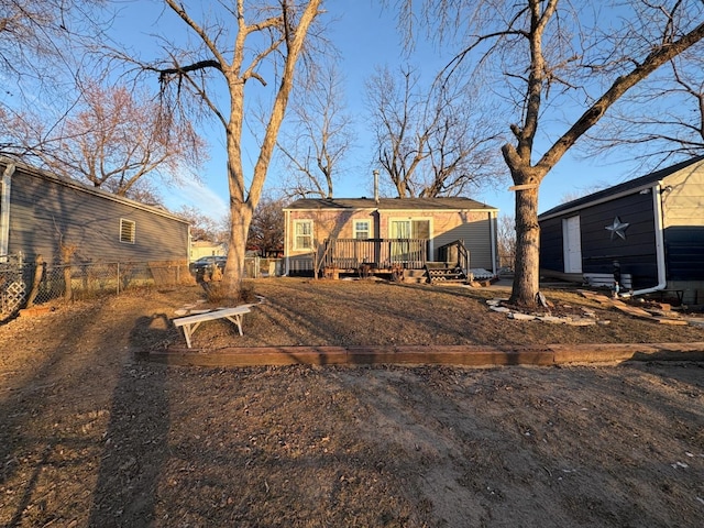 back of house featuring a deck