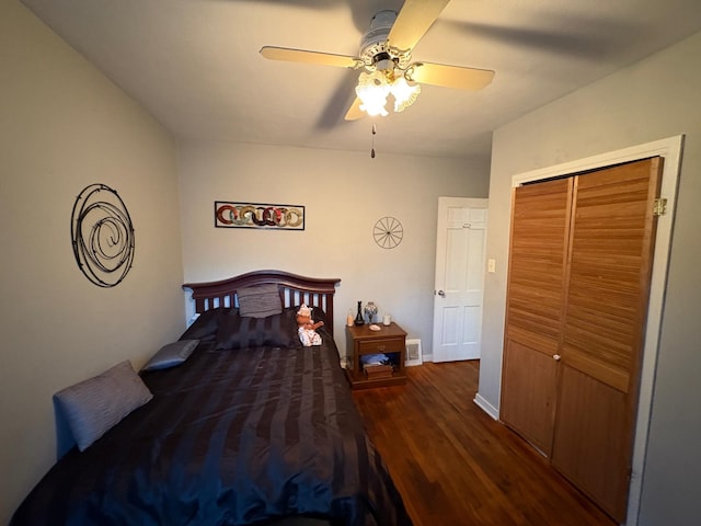 bedroom featuring ceiling fan, a closet, and dark hardwood / wood-style floors