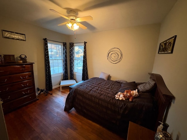 bedroom featuring dark wood-type flooring and ceiling fan