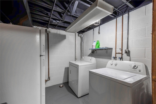 washroom with independent washer and dryer