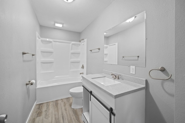 full bathroom with vanity, toilet, bathtub / shower combination, and wood-type flooring