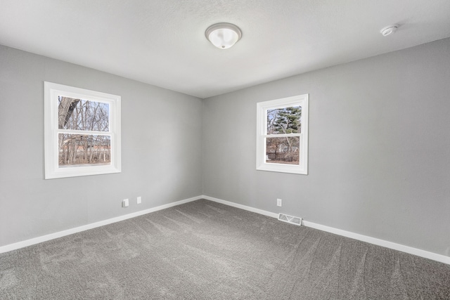 unfurnished room featuring carpet floors