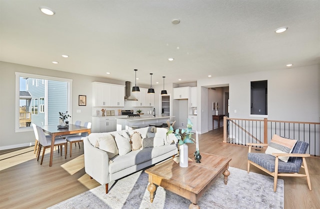 living room featuring sink and light wood-type flooring