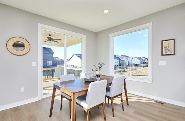 dining area with light wood-type flooring