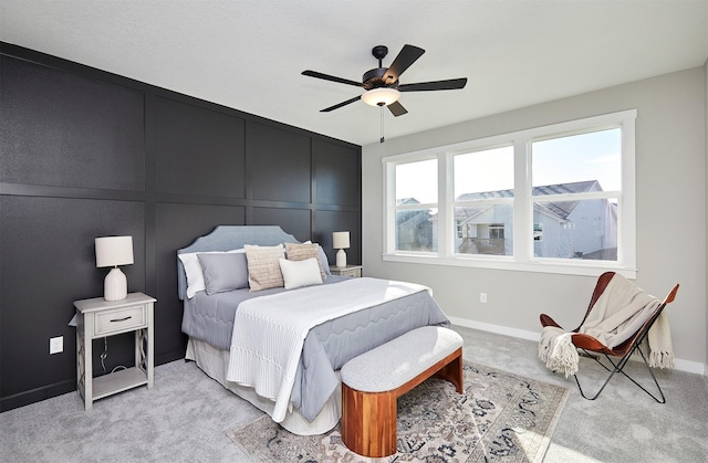 bedroom featuring ceiling fan and light carpet