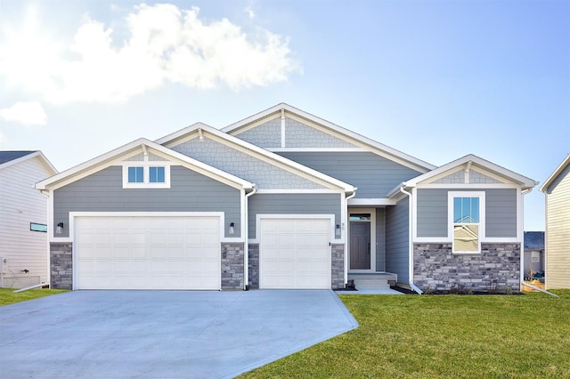 craftsman inspired home with a garage and a front lawn