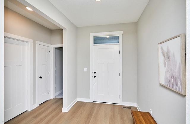 entrance foyer with light wood-type flooring