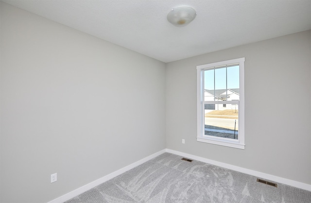 empty room with carpet flooring