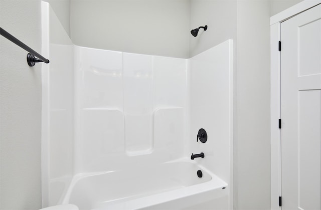 bathroom featuring  shower combination