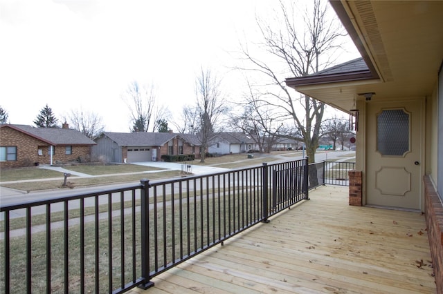 wooden deck featuring a garage