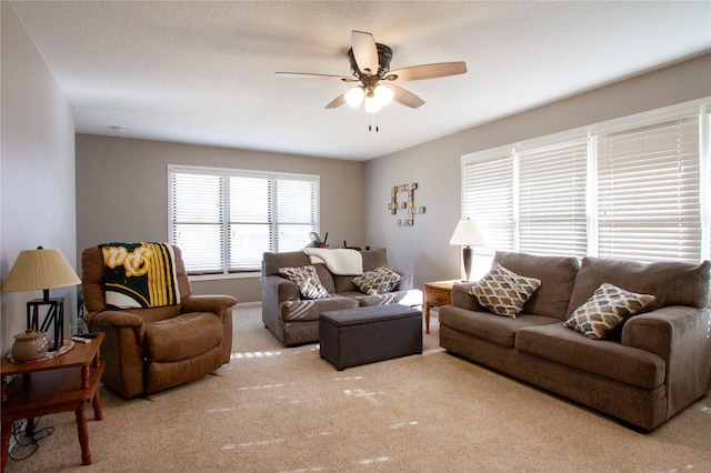 living room featuring ceiling fan and light colored carpet