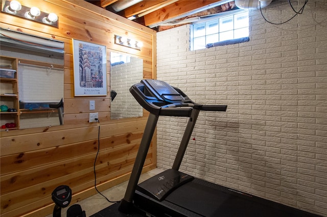 workout area featuring wooden walls