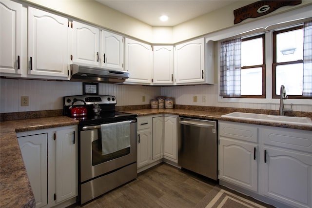 kitchen featuring sink, white cabinets, dark hardwood / wood-style floors, and stainless steel appliances