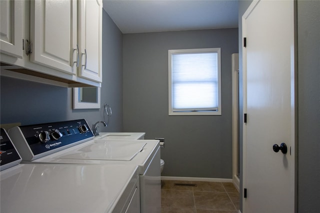 washroom featuring washer and dryer, sink, tile patterned floors, and cabinets