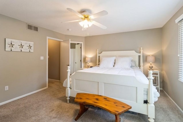 bedroom featuring ceiling fan and carpet