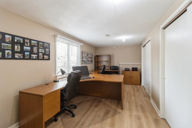 home office featuring light hardwood / wood-style floors