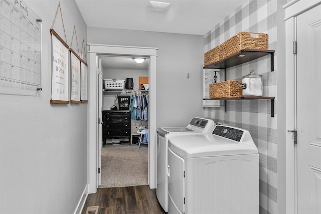 washroom featuring dark hardwood / wood-style flooring and washer and dryer