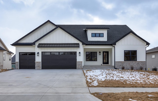 view of front of home featuring a garage and cooling unit