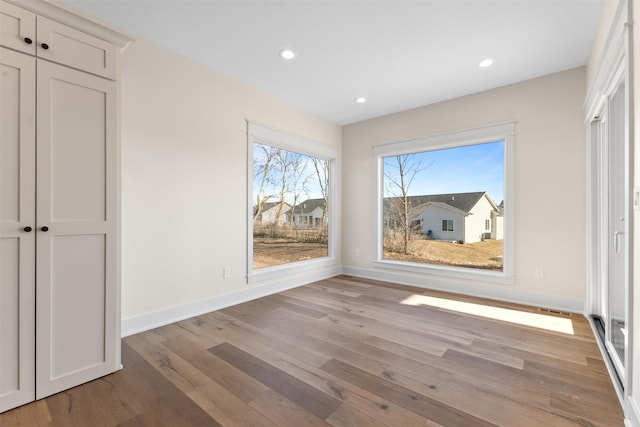 unfurnished dining area with light hardwood / wood-style flooring