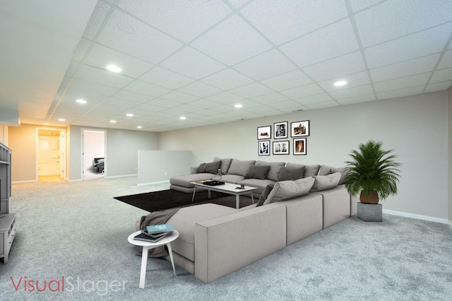 living room featuring recessed lighting, carpet flooring, baseboards, and a paneled ceiling