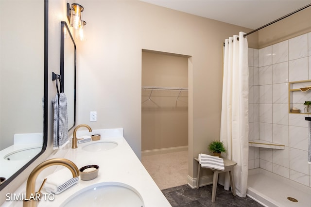 bathroom featuring a shower with curtain and vanity