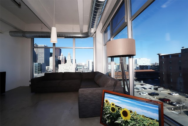 living room featuring concrete flooring