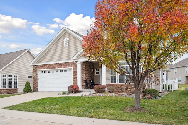 view of front of property with a garage and a front lawn